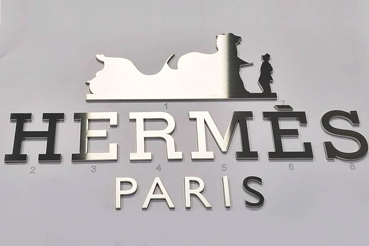 Hermès Paris enseigne commerciale inox brossé