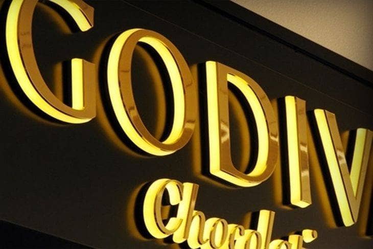 enseigne lumineuse lettres semelle débordante titanium gold miroir