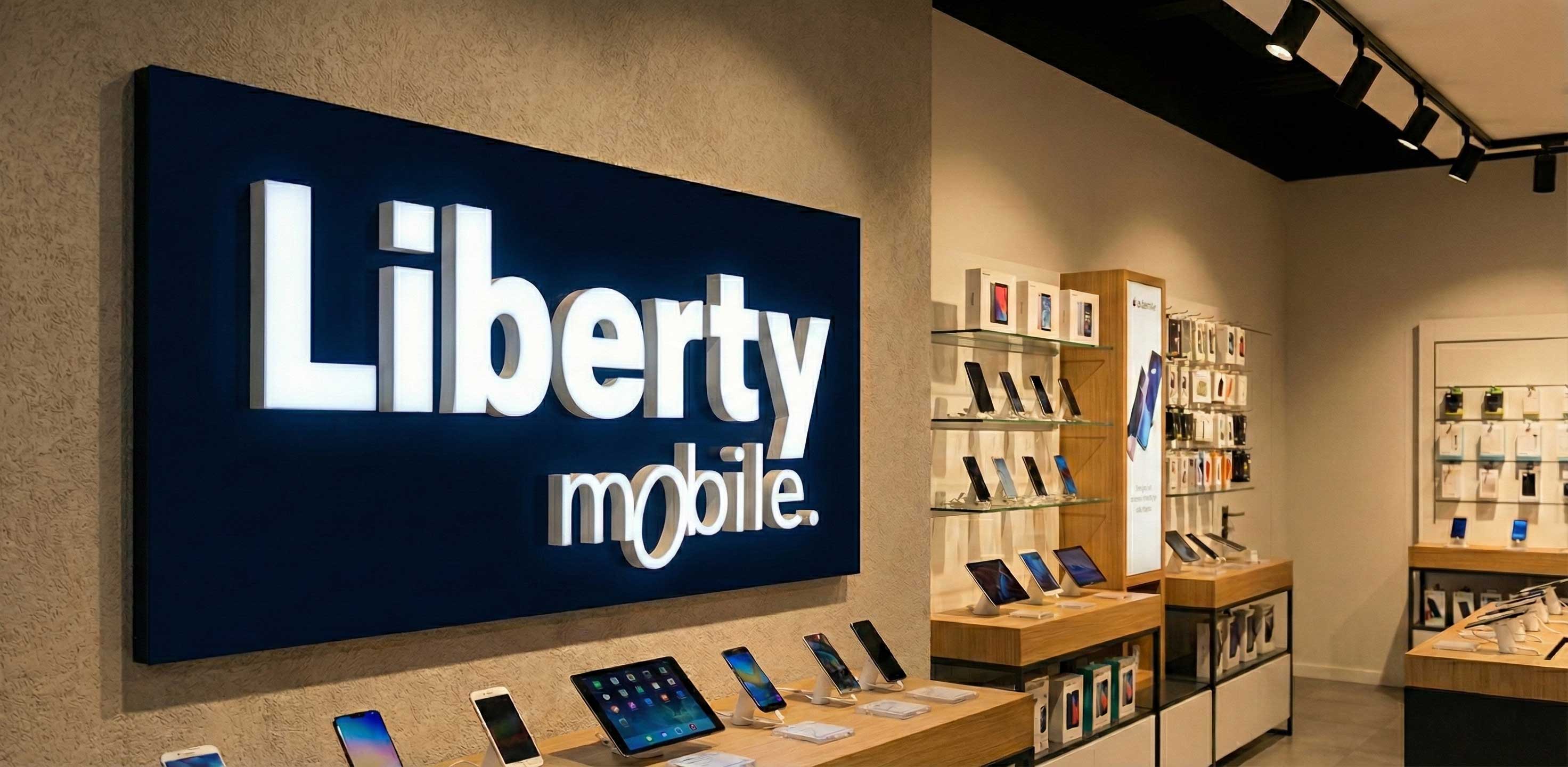 Liberty Mobile - lettres publicitaires sur panneau support - intérieur de boutique